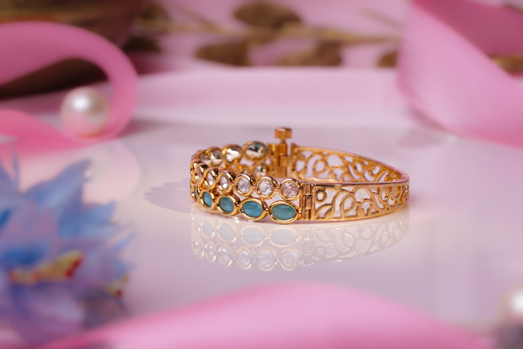 Elegant Gold Bracelet with Emerald and Crystal Accents